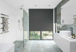 modern bathroom with roller blinds in dark grey